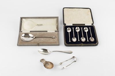 Lot 816 - An Arts & Crafts spoon of spot hammered design,...