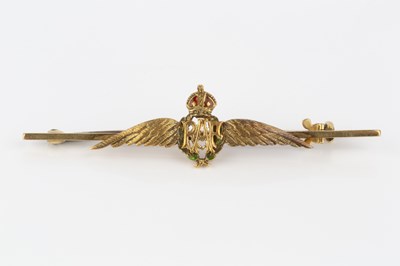 Lot 149 - An RAF wings bar brooch, heightened with green...