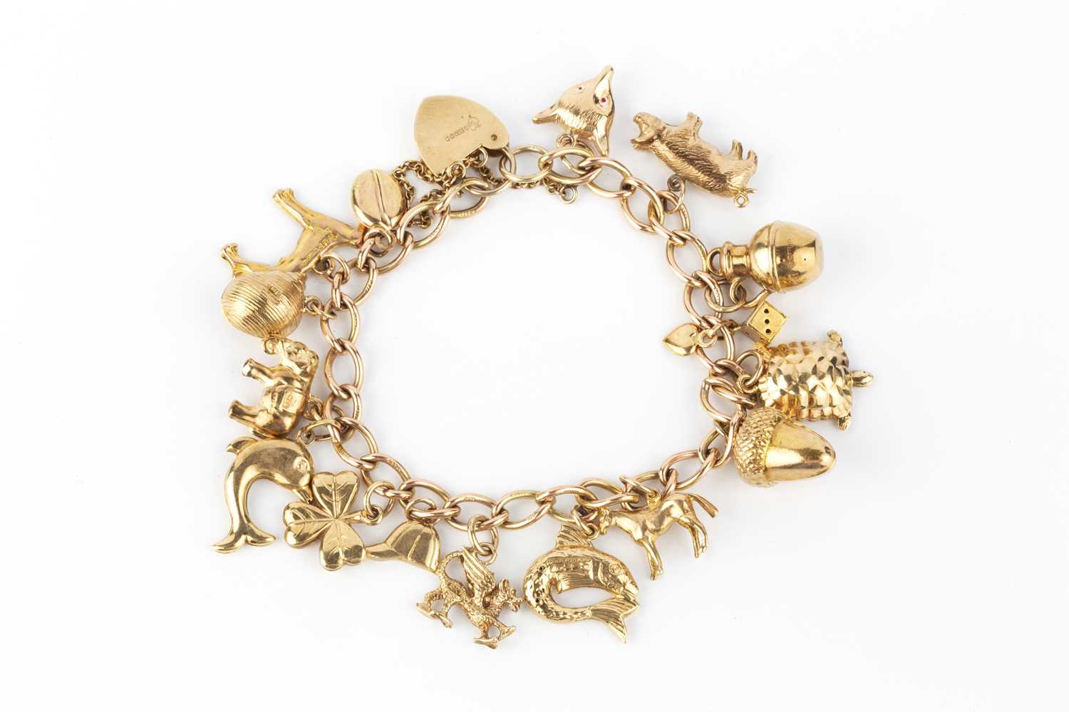 Lot 15 - A 9ct gold bracelet, the curb-link bracelet...