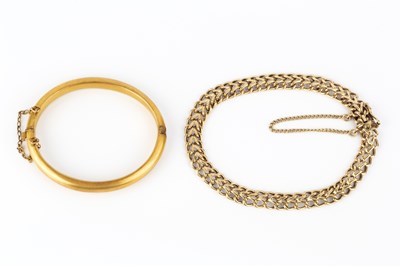 Lot 28 - A 9ct gold child's bangle, of hinged oval...