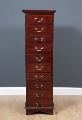 Lot 513 - A 20th century tall hardwood chest of ten...