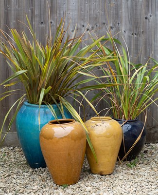 Lot 842 - A green glazed ovoid garden planter or jar...