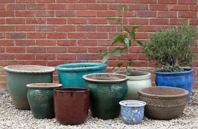 Lot 847 - A group of various glazed garden planters the...