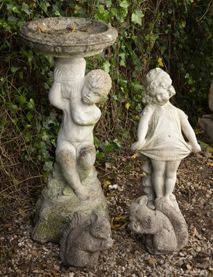 Lot 856 - A reconstituted stone bird bath in the form of...