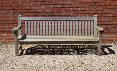 Lot 866 - An old teak garden bench 213cm wide