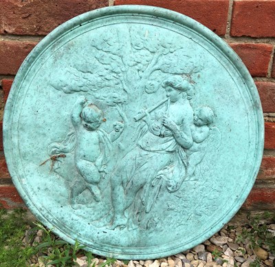 Lot 871 - A green painted cast concrete roundel...