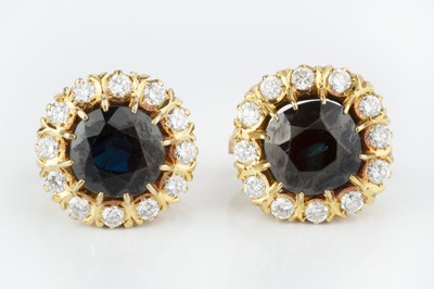 Lot 166 - A pair of sapphire and diamond cluster ear...