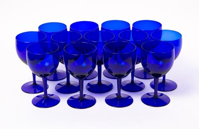 Lot 535 - A set of thirteen blue glass wine goblets...