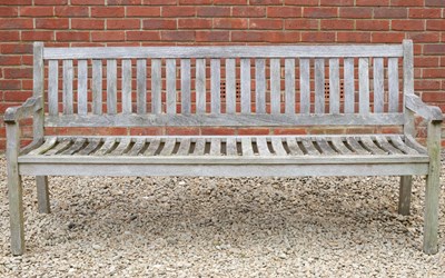 Lot 884 - A teak garden bench 190cm wide x 90cm high