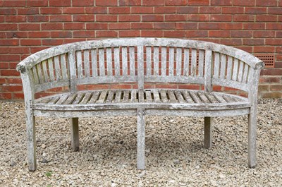 Lot 881 - A garden bench with serpentine front and...