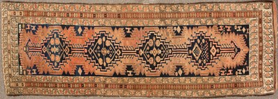 Lot 550 - An antique Oriental brown ground runner, the...