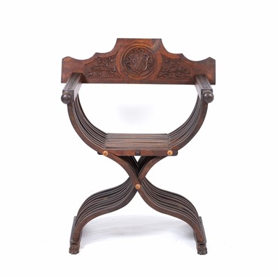 Lot 507 - A continental walnut Savonarola chair with...