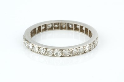 Lot 243 - A diamond full hoop eternity ring, set...