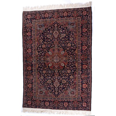 Lot 597 - A Persian, probably Tabriz, dark blue ground...