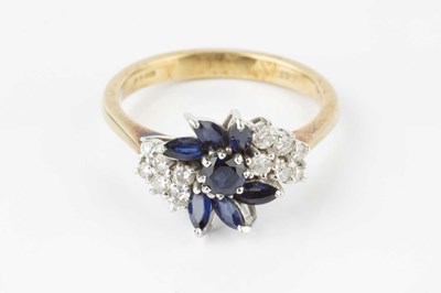 Lot 167 - A sapphire and diamond cluster ring, designed...