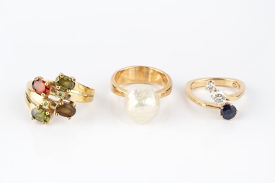 Lot 285 - Three gem set dress rings, comprising a...