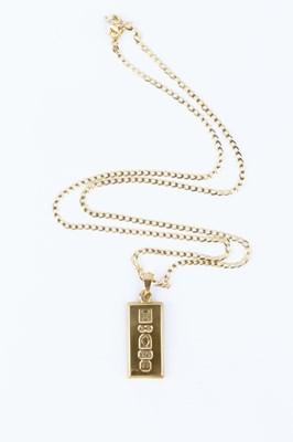 Lot 52 - A 9ct gold ingot pendant, suspended from a 9ct...