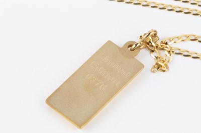 Lot 52 - A 9ct gold ingot pendant, suspended from a 9ct...