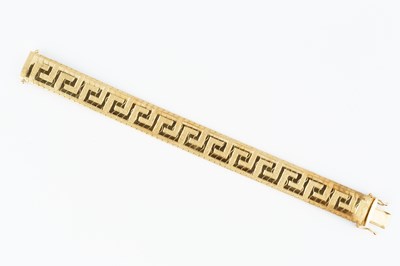 Lot 13 - A yellow precious metal bracelet, of Greek key...