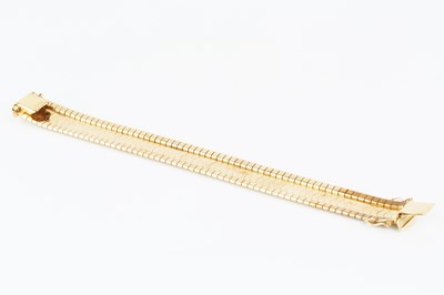 Lot 13 - A yellow precious metal bracelet, of Greek key...