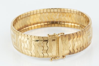 Lot 13 - A yellow precious metal bracelet, of Greek key...