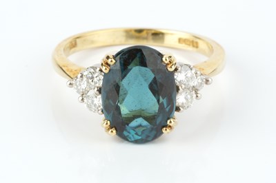 Lot 226 - A blue tourmaline and diamond dress ring, the...