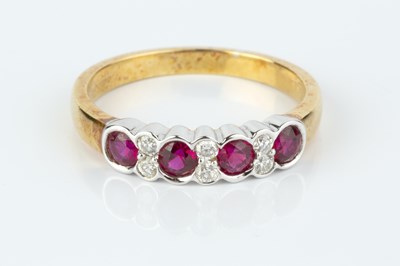 Lot 153 - A ruby and diamond half hoop ring, alternately...