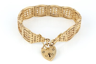 Lot 12 - A 9ct gold fancy gate-link bracelet, with...