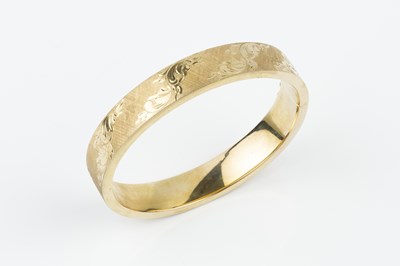 Lot 62 - A 9ct gold bangle, of hinged oval form,...