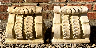 Lot 526 - A pair of cast reconstituted stone scrolling...