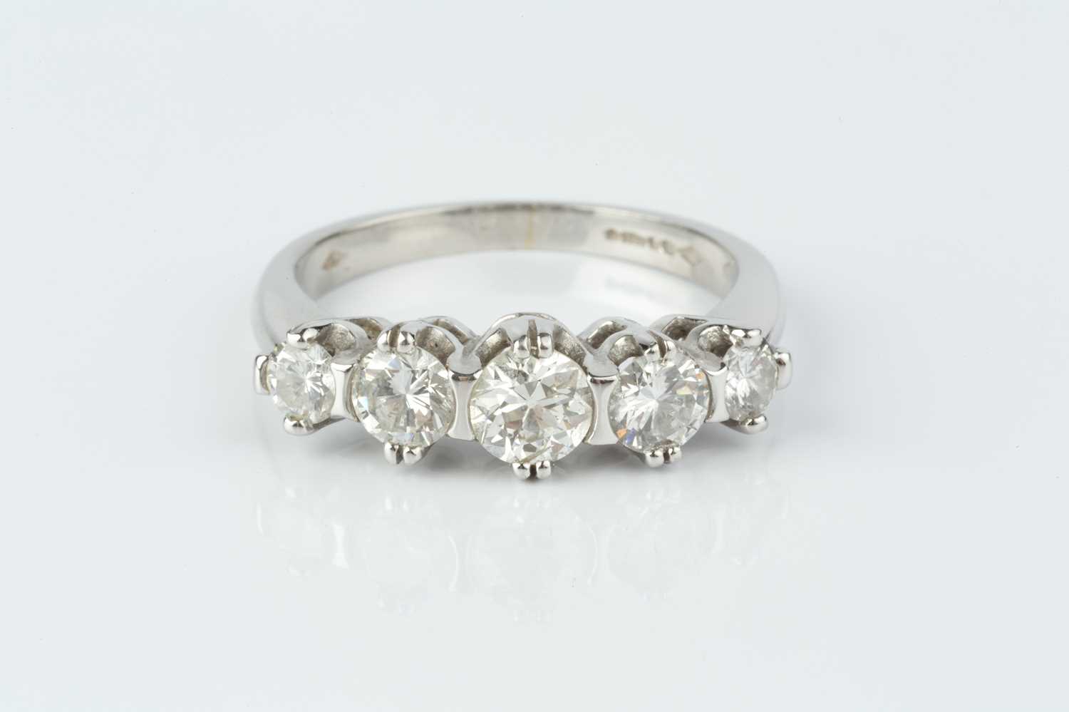 Lot 230 - A diamond five stone ring, the graduated round...