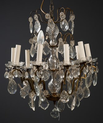 Lot 300 - A French nine-light chandelier, with four...