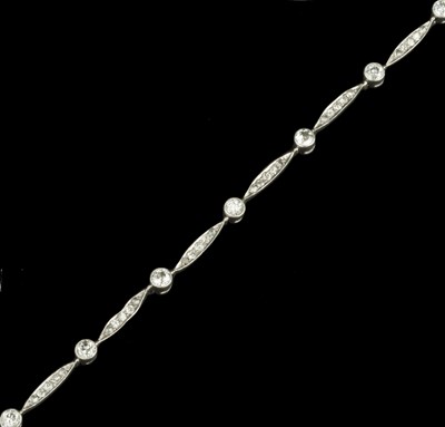 Lot 245 - A diamond panel bracelet, designed as a series...