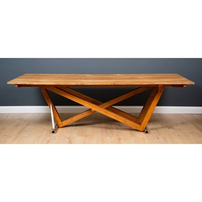 Lot 203 - A contemporary oak dining table, the six plank...