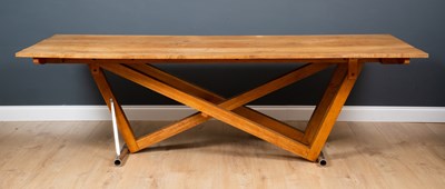 Lot 203 - A contemporary oak dining table, the six plank...