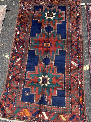 Lot 629 - A Russian Kazakh red, blue and green ground...