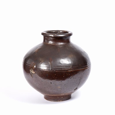 Lot 75 - A Chinese Tang Dynasty stoneware vessel,...