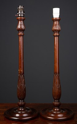 Lot 102 - A pair of turned mahogany table lamps each...