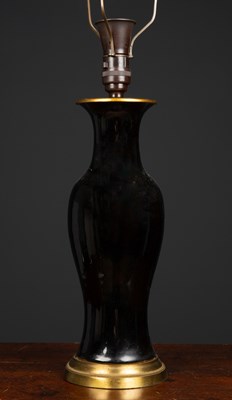 Lot 132 - A late 19th century black glazed porcelain...