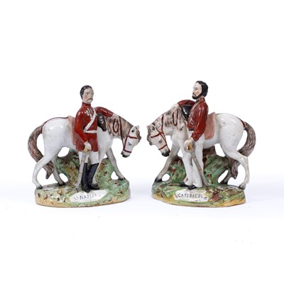 Lot 17 - A pair of Staffordshire pottery figures, of...