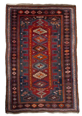 Lot 210 - A Kasak polychrome rug with six central hooked...