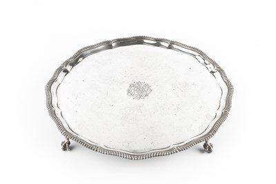 Lot 645 - An Edwardian silver salver, with shaped and...