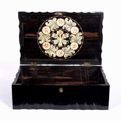 Lot 170 - An Oriental ebonized hardwood box, carved...