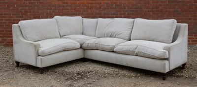 Lot 261 - A modern cream upholstered L shaped sofa...