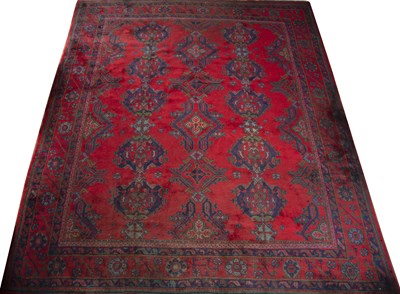 Lot 113 - An old Turkey Oushak carpet with repeating...