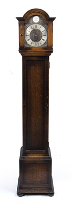 Lot 142 - An early 20th century oak grandmother clock,...