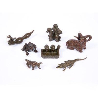 Lot 144 - A bronze miniature figure of a recumbent ram,...