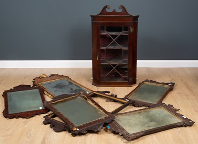 Lot 211 - A mahogany hanging corner cabinet with scroll...