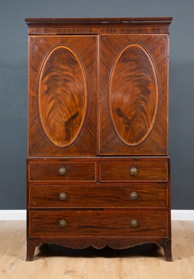 Lot 213 - A George III veneered mahogany linen press,...
