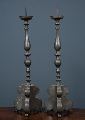 Lot 135 - A pair of pewter pricket candlesticks on...